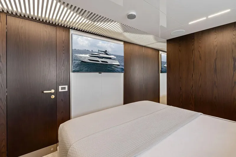Slide: The Image of Luxurious Ferretti 850 yacht bedroom interior with modern wood paneling, 2022 model. - 53