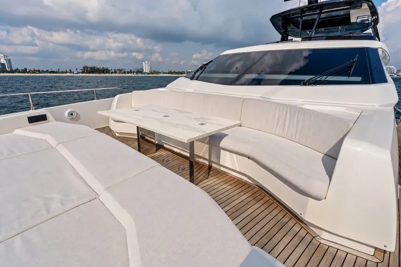 Slide: The Image of Luxurious 2022 Ferretti 850 yacht deck with elegant seating and ocean view. - 74