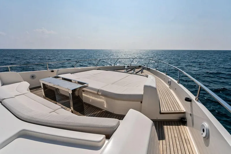 Slide: The Image of Luxurious 2022 Ferretti 850 yacht deck with sun loungers and ocean view. - 22