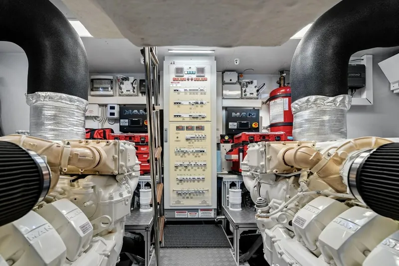 Slide: The Image of Engine room of a 2022 Ferretti 850 yacht, featuring advanced machinery and control systems. - 64