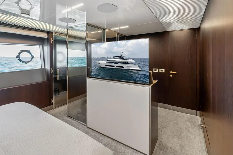 Slide: The Image of Luxurious interior of 2022 Ferretti 850 yacht with ocean view and modern TV setup. - 45
