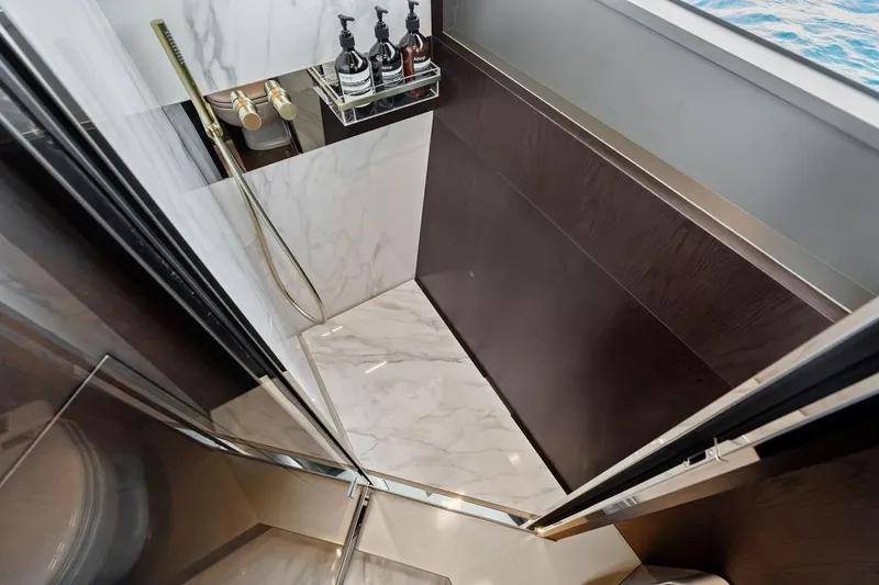 Slide: The Image of Luxurious shower area in 2022 Ferretti 850 yacht with marble and elegant fixtures. - 60