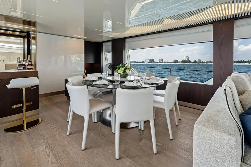 Slide: The Image of Luxurious dining area on 2022 Ferretti 850 yacht with ocean view and elegant decor. - 32