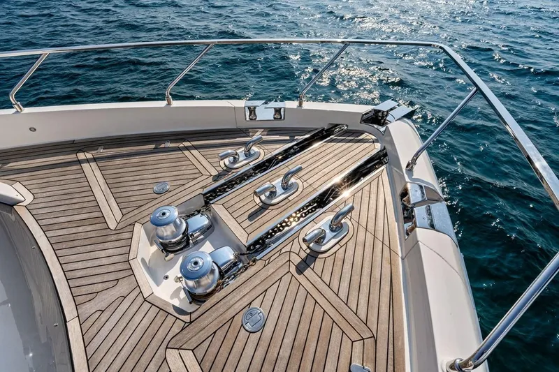 Slide: The Image of Deck of 2022 Ferretti 850 yacht with polished wood and metal fittings. - 26