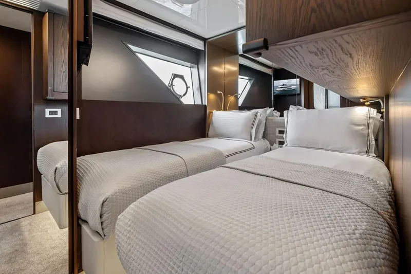 Slide: The Image of Luxurious twin bedroom interior on a 2022 Ferretti 850 yacht, featuring elegant bedding and modern design. - 56