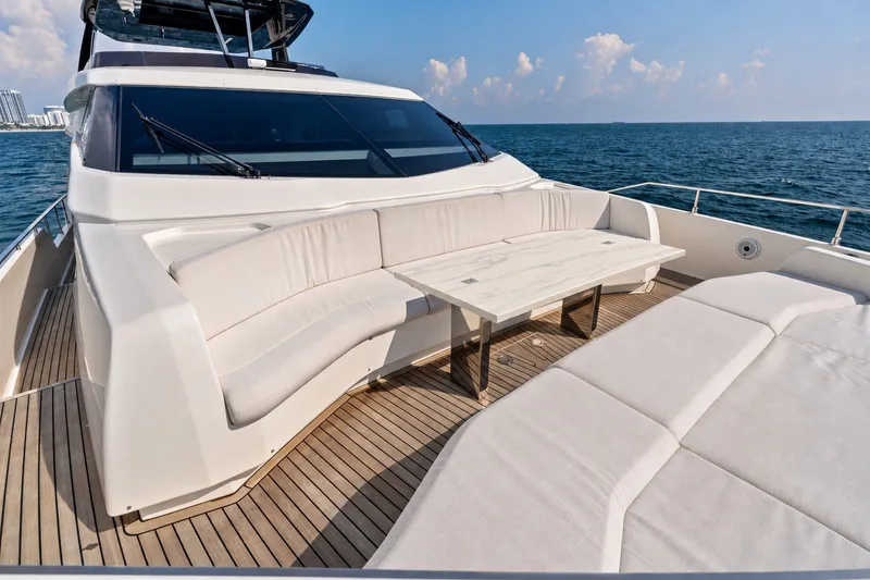 Slide: The Image of Luxurious 2022 Ferretti 850 yacht deck with elegant seating and ocean view. - 73