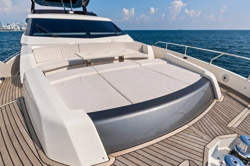 Slide: The Image of Luxurious 2022 Ferretti 850 yacht deck with sunbathing area and ocean view. - 76