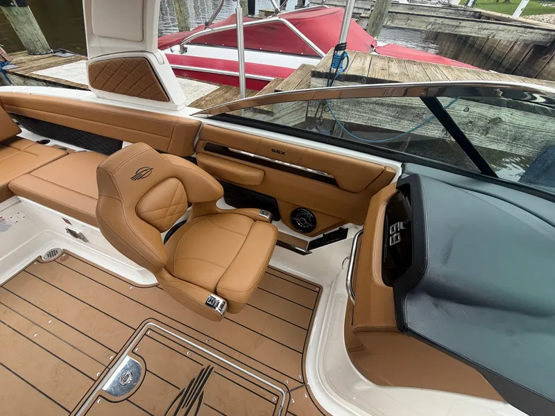Slide: The Image of The image shows the cockpit of a 2025 Chaparral 267 SSX with brown leather seats. - 15