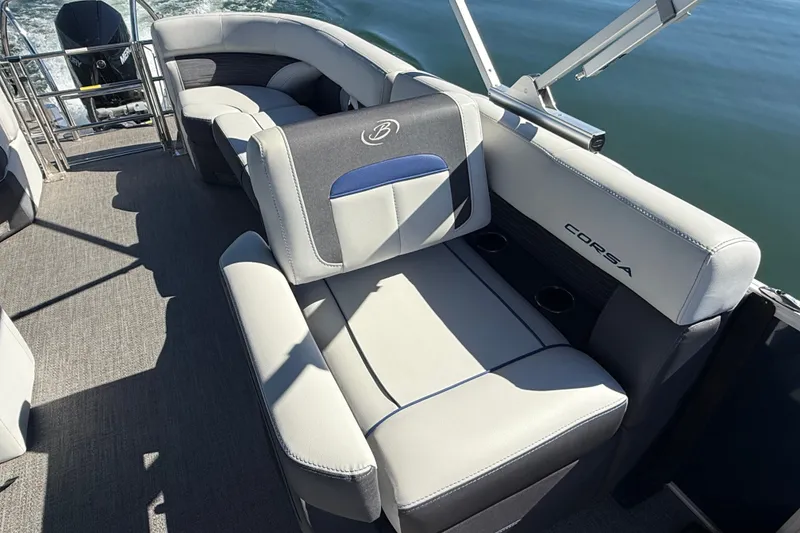 Slide: The Image of 2023 Barletta CORSA 23QSS pontoon boat interior with plush seating and cup holders. - 9