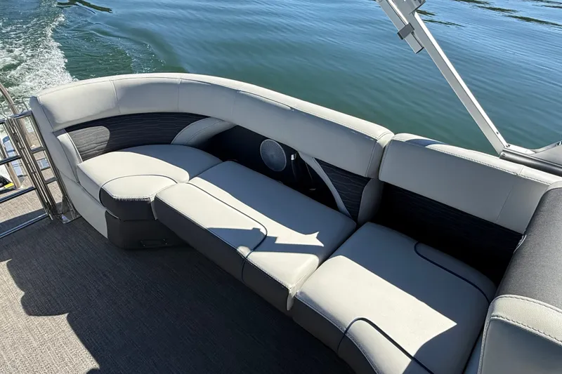 Slide: The Image of 2023 Barletta CORSA 23QSS pontoon boat with luxurious seating on calm water. - 7