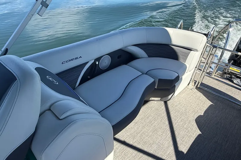 Slide: The Image of 2023 Barletta CORSA 23QSS boat interior with luxurious seating on calm water. - 8