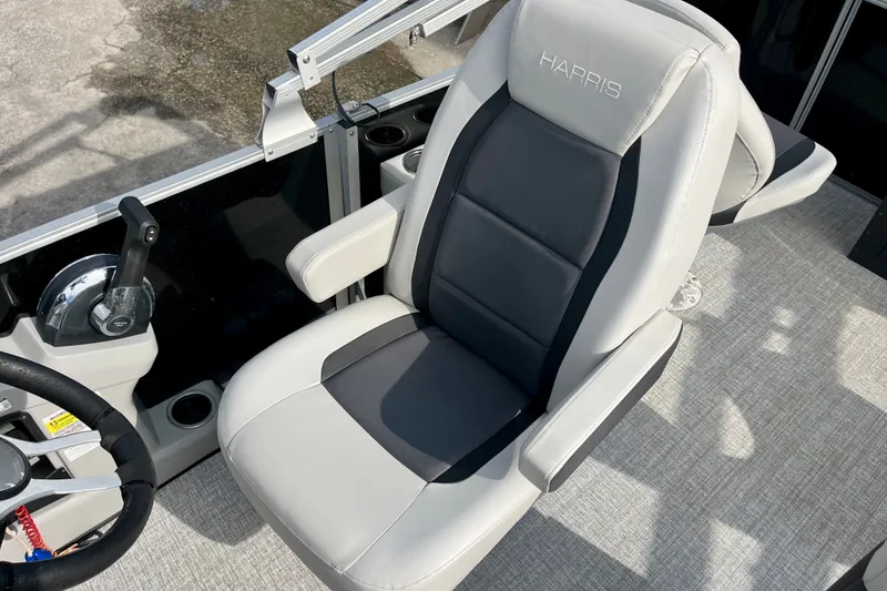 Slide: The Image of Captain's chair on 2024 Harris Cruiser 230 boat, featuring sleek design and comfortable seating. - 5
