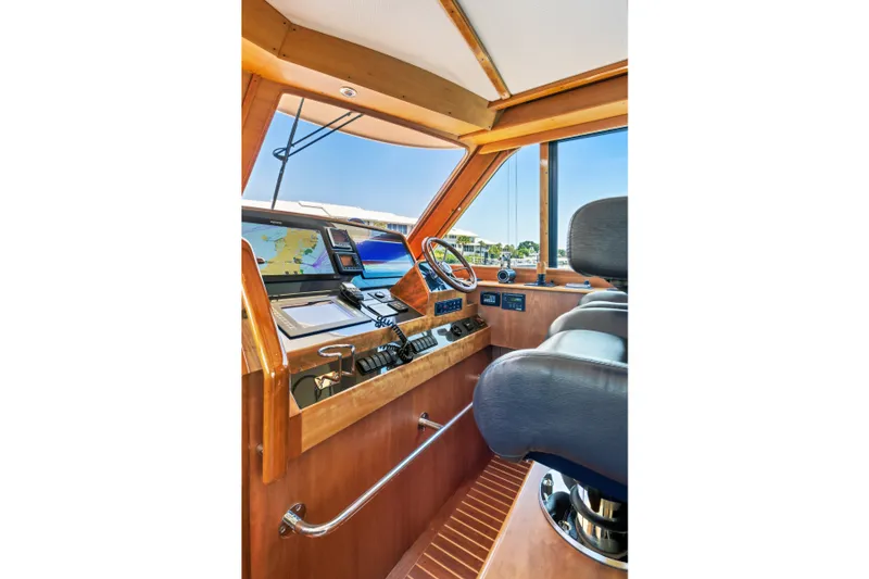 Slide: The Image of Helm of 2007 Hinckley Talaria 55 yacht with navigation equipment and leather seating. - 28