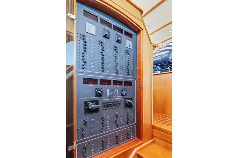Slide: The Image of Electrical control panel on a 2007 Hinckley Talaria 55 yacht, featuring switches and displays. - 9