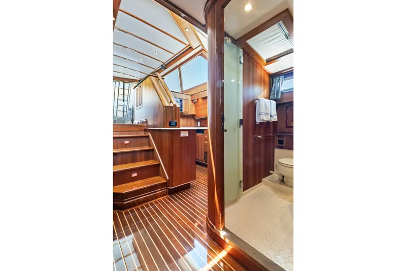 Slide: The Image of Luxurious interior of 2007 Hinckley Talaria 55 yacht, featuring wooden finishes and modern amenities. - 18