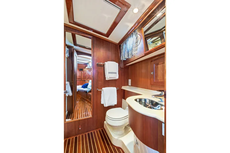 Slide: The Image of Luxurious 2007 Hinckley Talaria 55 yacht bathroom with wood paneling and modern fixtures. - 21