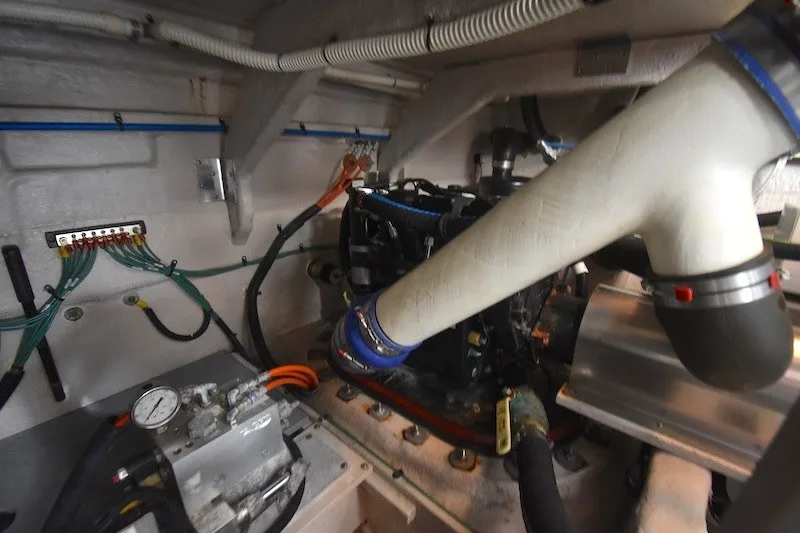 Slide: The Image of Engine room of 2015 Sea Ray 510 Fly yacht, showcasing mechanical components and wiring. - 37