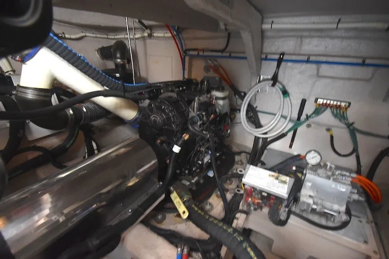 Slide: The Image of Engine room of a 2015 Sea Ray 510 Fly yacht, showcasing mechanical components. - 36
