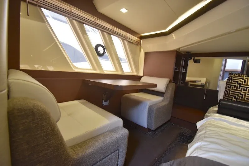 Slide: The Image of Luxurious interior of 2015 Sea Ray 510 Fly yacht with seating and dining area. - 21