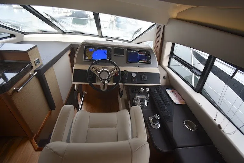 Slide: The Image of Interior helm of 2015 Sea Ray 510 Fly yacht with modern navigation equipment. - 23