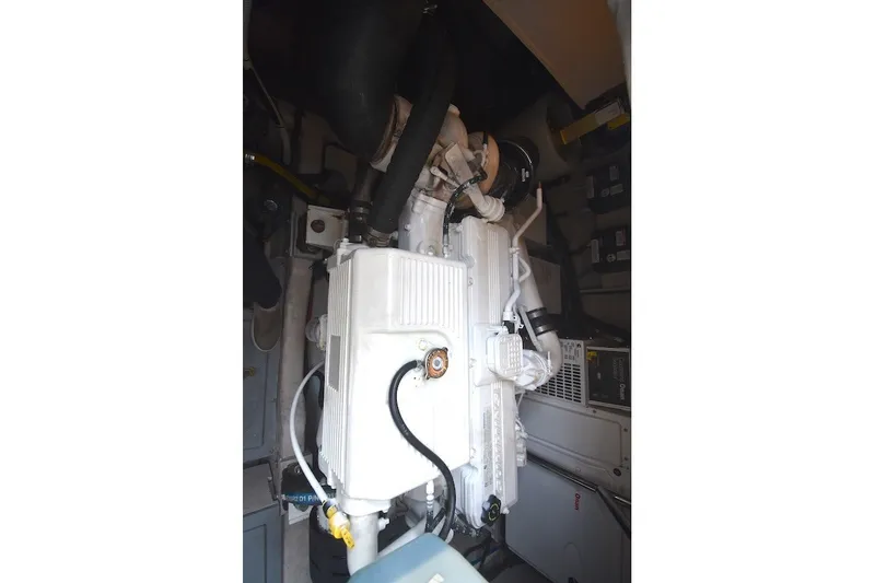 Slide: The Image of Engine compartment of a 2015 Sea Ray 510 Fly yacht, showcasing mechanical components. - 34