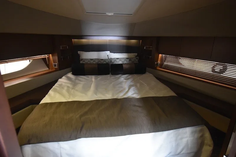 Slide: The Image of Luxurious bedroom interior of 2015 Sea Ray 510 Fly yacht with elegant bedding. - 16