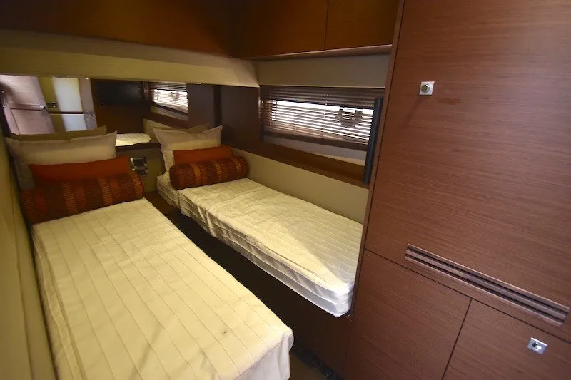 Slide: The Image of Luxurious twin cabin interior of 2015 Sea Ray 510 Fly yacht with modern wood finishes. - 17