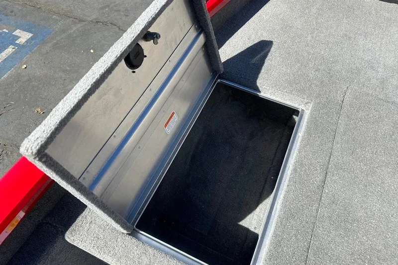 Slide: The Image of Open storage compartment on 2012 Tracker Pro Team 175 TXW boat deck. - 17