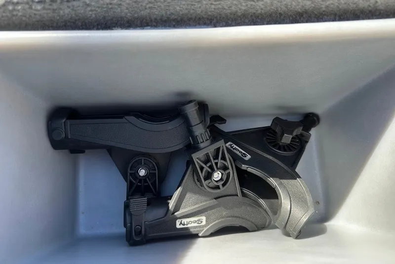 Slide: The Image of Storage compartment with Scotty rod holders in a 2012 Tracker Pro Team 175 TXW boat. - 24