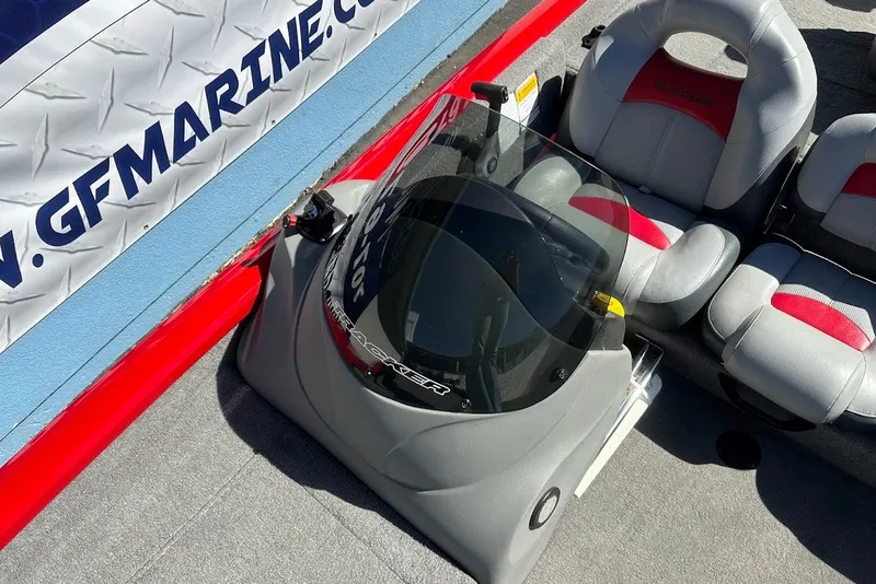 Slide: The Image of 2012 Tracker Pro Team 175 TXW boat interior with gray and red seating. - 22