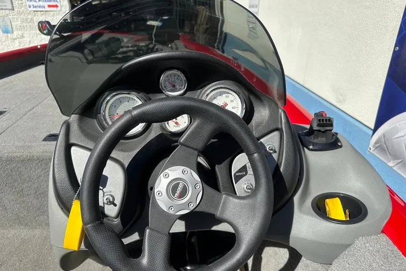 Slide: The Image of Steering console of 2012 Tracker Pro Team 175 TXW boat with gauges and controls. - 14