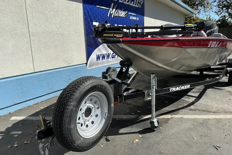 The Image of 2012 Tracker Pro Team 175 TXW boat on trailer, parked outdoors. - 0