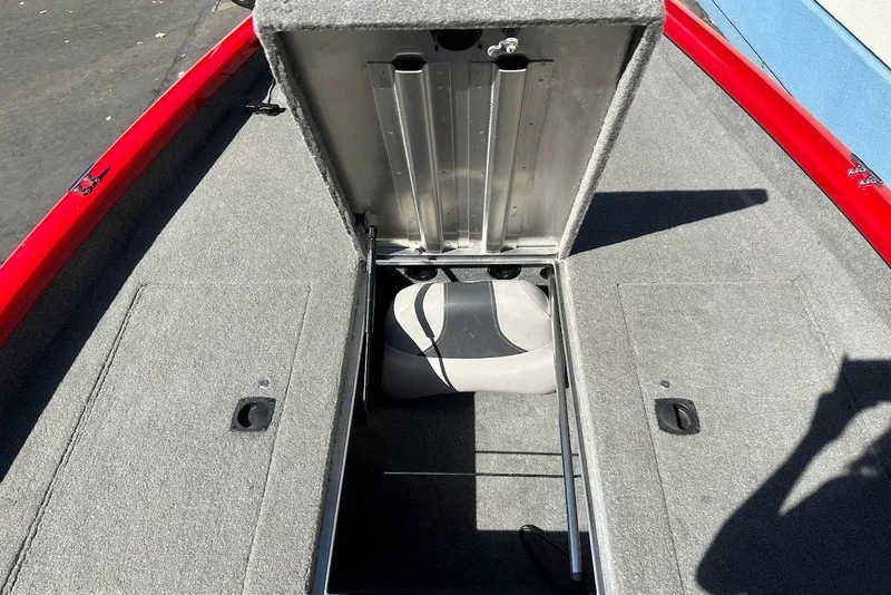 Slide: The Image of 2012 Tracker Pro Team 175 TXW boat storage compartment with open lid. - 16