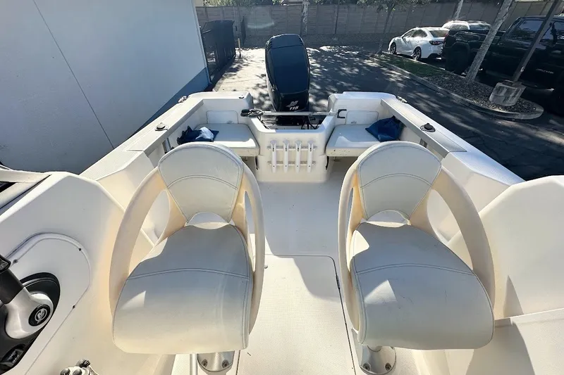 Slide: The Image of 2005 Trophy 1802 Walkaround boat interior with seating and storage compartments. - 17