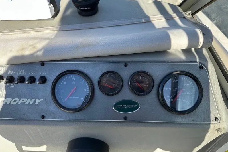 Slide: The Image of Dashboard of a 2005 Trophy 1802 Walkaround boat with gauges and switches. - 25