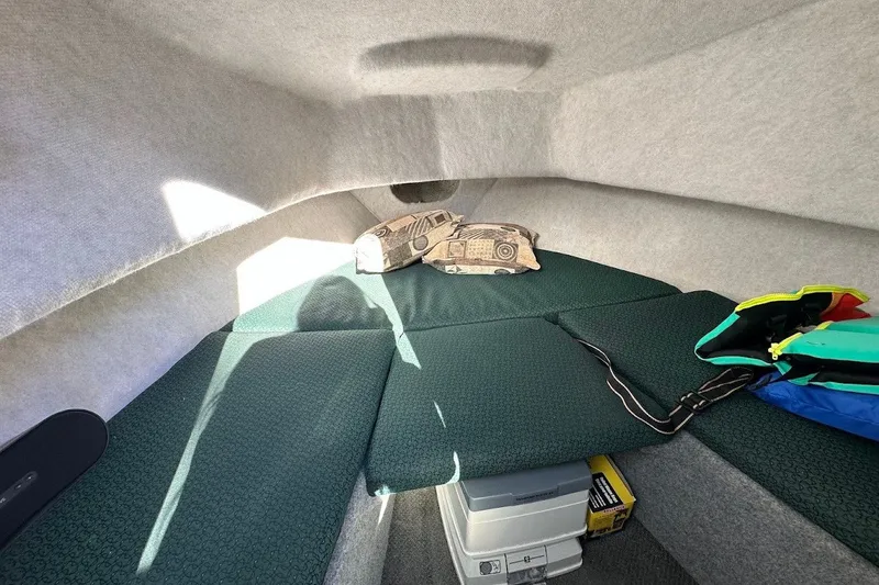 Slide: The Image of Interior cabin of a 2005 Trophy 1802 Walkaround boat with cushions and storage. - 15