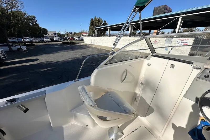 Slide: The Image of 2005 Trophy 1802 Walkaround boat interior with seating and steering area. - 20