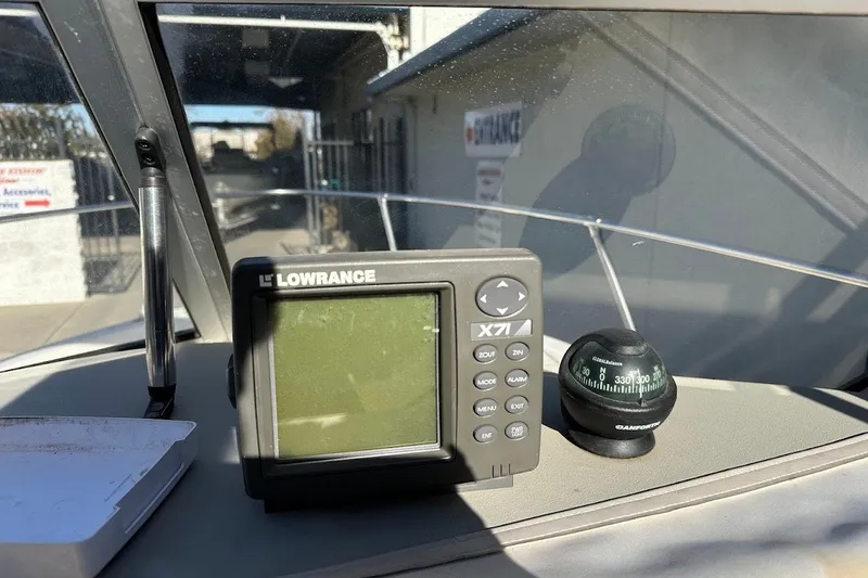 Slide: The Image of Dashboard of a 2005 Trophy 1802 Walkaround with Lowrance X71 fishfinder and compass. - 27
