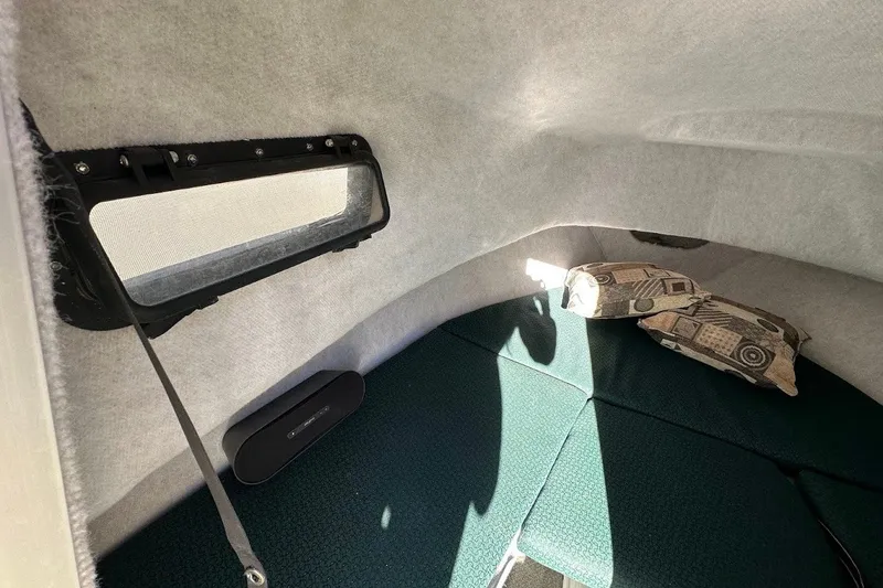 Slide: The Image of Interior cabin of 2005 Trophy 1802 Walkaround boat with cushions and window. - 12