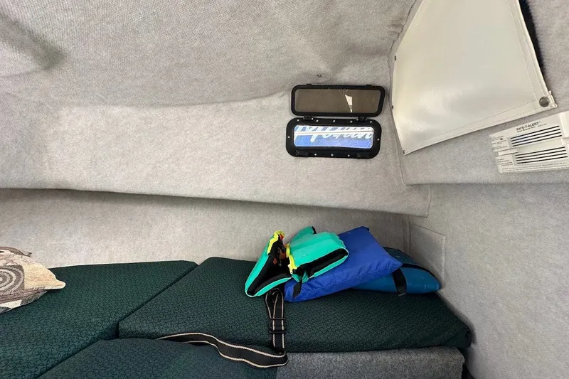 Slide: The Image of Interior cabin of a 2005 Trophy 1802 Walkaround boat with life jackets. - 14