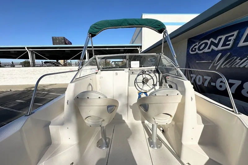 Slide: The Image of 2005 Trophy 1802 Walkaround boat interior with steering wheel and seating. - 19