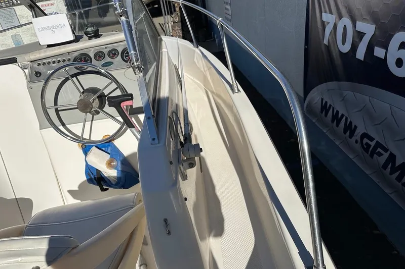 Slide: The Image of 2005 Trophy 1802 Walkaround boat interior with steering wheel and dashboard controls. - 31