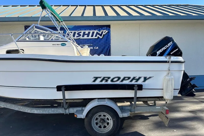Slide: The Image of 2005 Trophy 1802 Walkaround boat on trailer with Mercury outboard motor. - 5