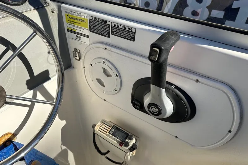Slide: The Image of Boat control panel of 2005 Trophy 1802 Walkaround with steering wheel and throttle lever. - 24