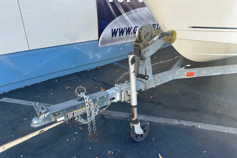 Slide: The Image of Trailer hitch of a 2005 Trophy 1802 Walkaround boat on pavement. - 3