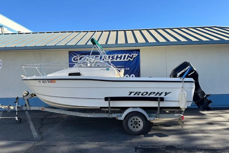 Slide: The Image of 2005 Trophy 1802 Walkaround boat on trailer with Mercury outboard motor. - 1