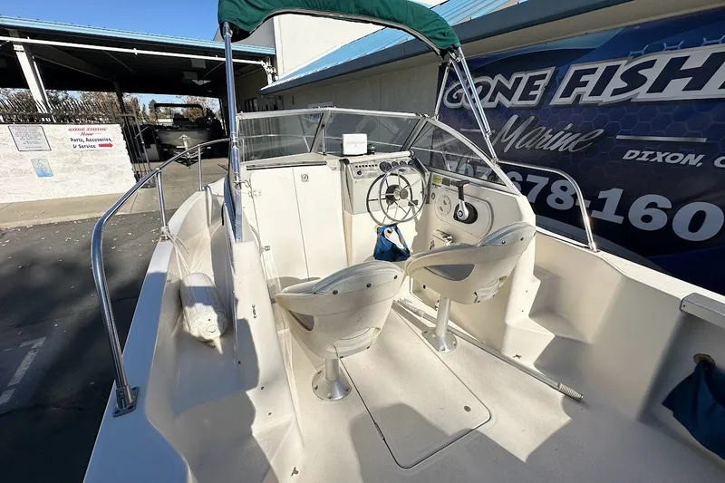 Slide: The Image of 2005 Trophy 1802 Walkaround boat interior with steering wheel and seating. - 18