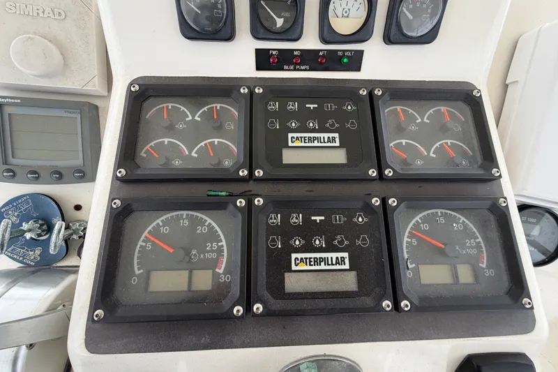 Slide: The Image of Instrument panel of a 2001 Ocean Yachts 48 Super Sport with Caterpillar gauges. - 21