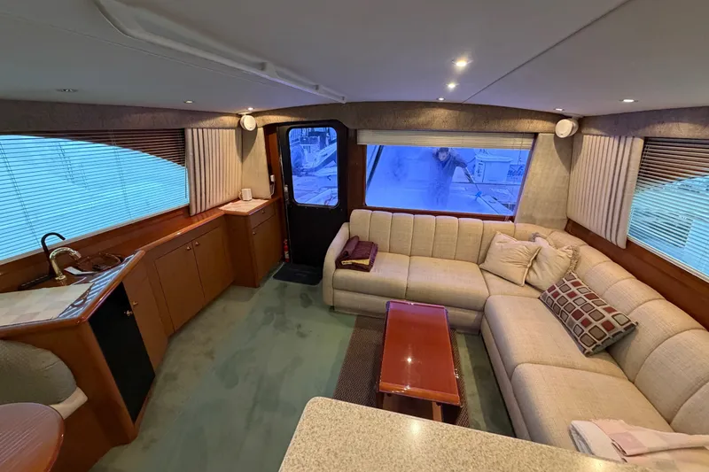 Slide: The Image of Luxurious interior of 2001 Ocean Yachts 48 Super Sport with plush seating and elegant decor. - 30