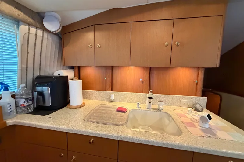 Slide: The Image of 2001 Ocean Yachts 48 Super Sport kitchen with sink, cabinets, and appliances. - 38